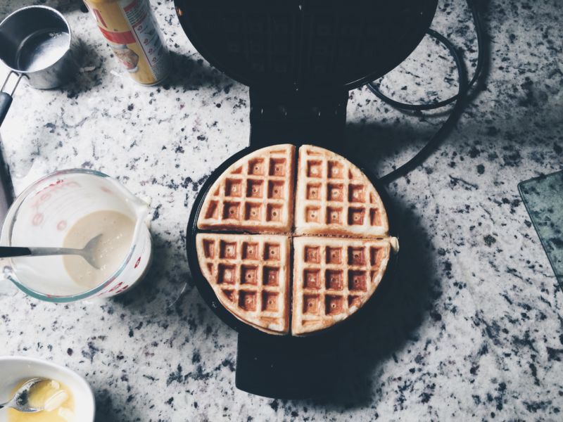 Where can we volunteer to be a stock photographer of waffle imagery? "High Angle View Of Waffles On Iron."