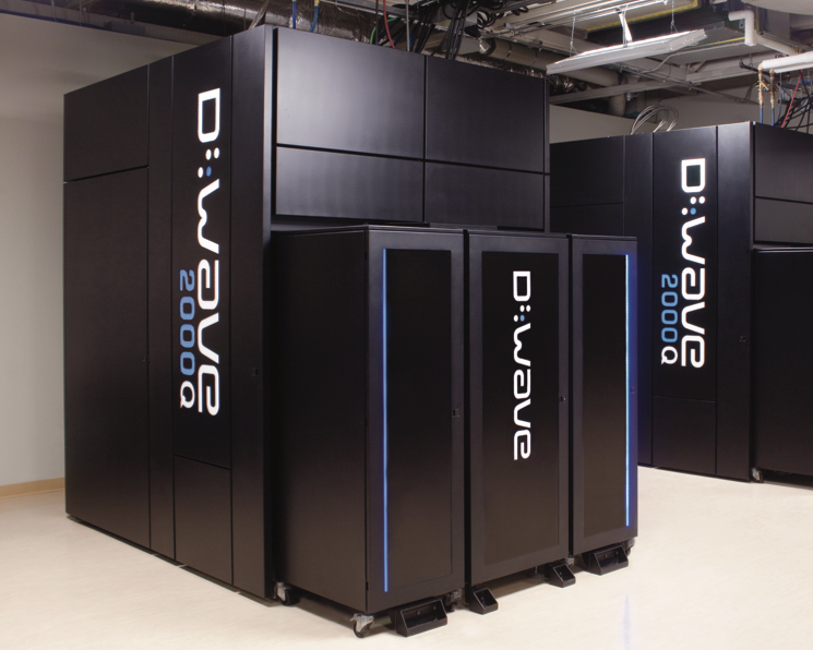 Image of large, black metal boxes that house D-Wave hardware.