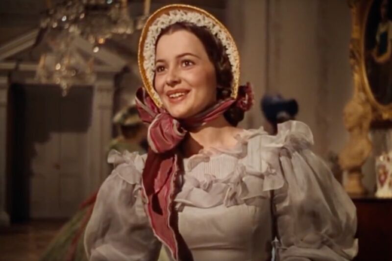 Olivia de Havilland—pictured here as Melanie Hamliton in the 1939 Oscar-Winning film <em>Gone with the Wind</em>—successfully sued Warner Bros. in 1943 to free herself from her studio contract. The groundbreaking lawsuit contributed to the breakup of the Hollywood studio system.”><figcaption class=