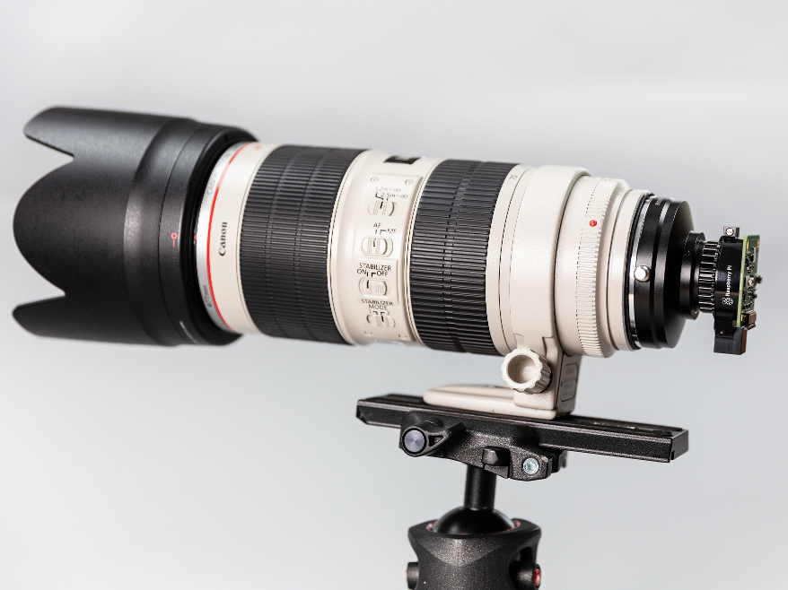 With an adapter, you can also attach, much, much bigger lenses. 